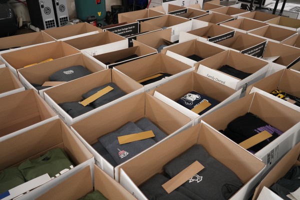 Finished custom shirt orders folded and boxed for shipping