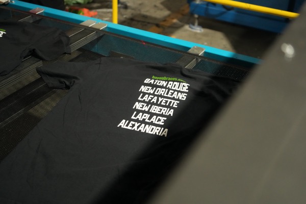Crisp white ink print coming off the press at 5Boys
